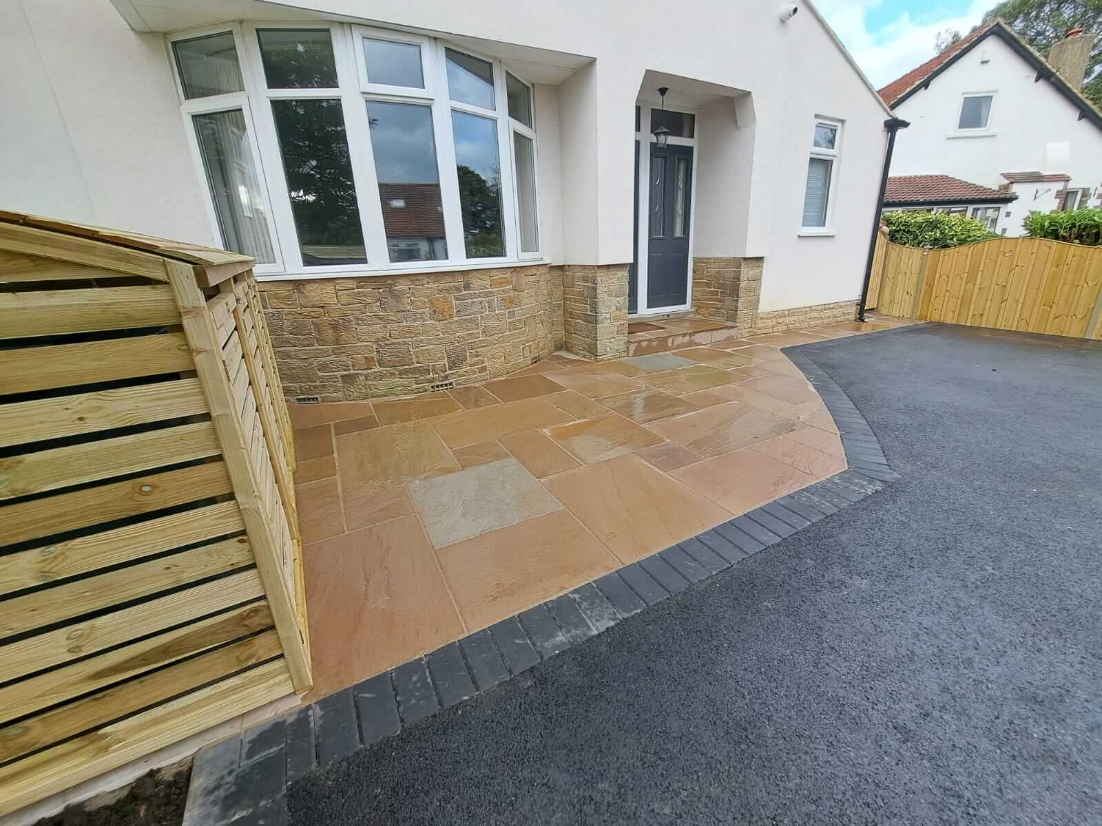 Tarmac driveway with Indian sandstone path and setts edging